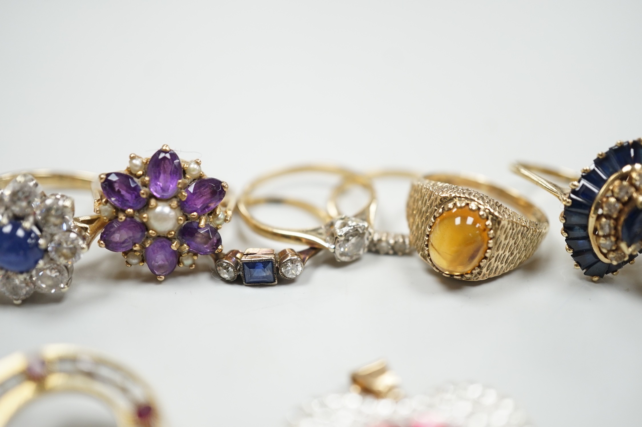 Eight assorted mainly modern 9ct gold and gem set dress rings, including amethyst and split pearl cluster, gross weight 30.7 grams, a 15ct, ruby and seed pearl set open work circular brooch, gross 2.6 grams, pair of 9ct,